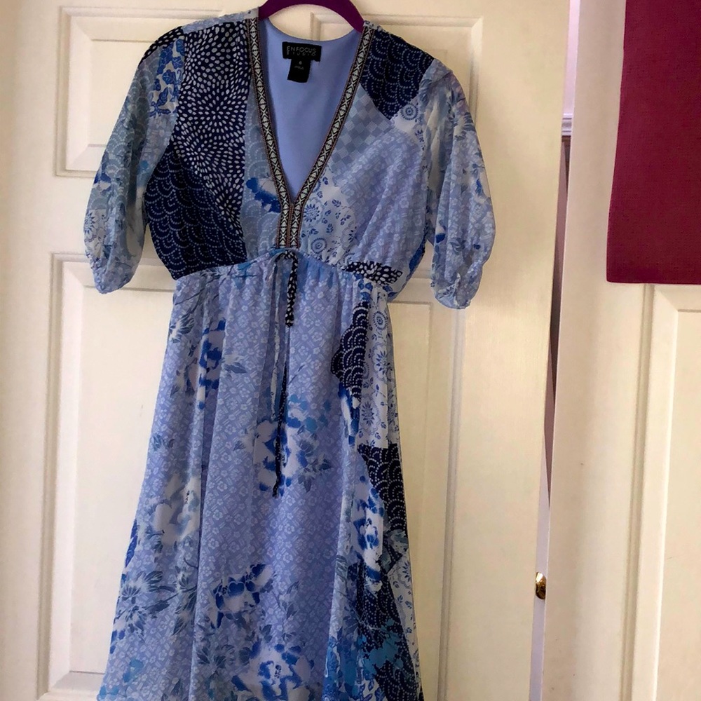 Multi-colored blue V-neck pattern dress.